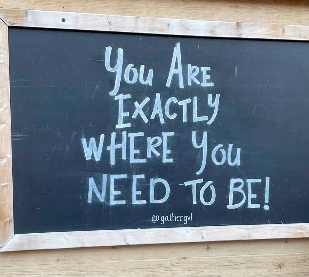 "You are exactly where you need to be" on a chalkboard 
