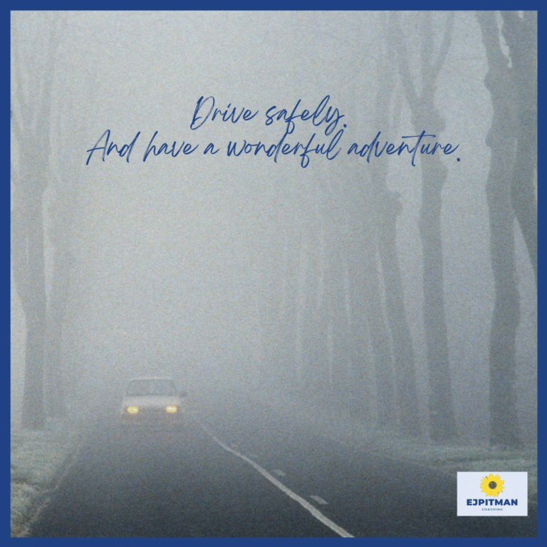 car driving through foggy woods with headlights on