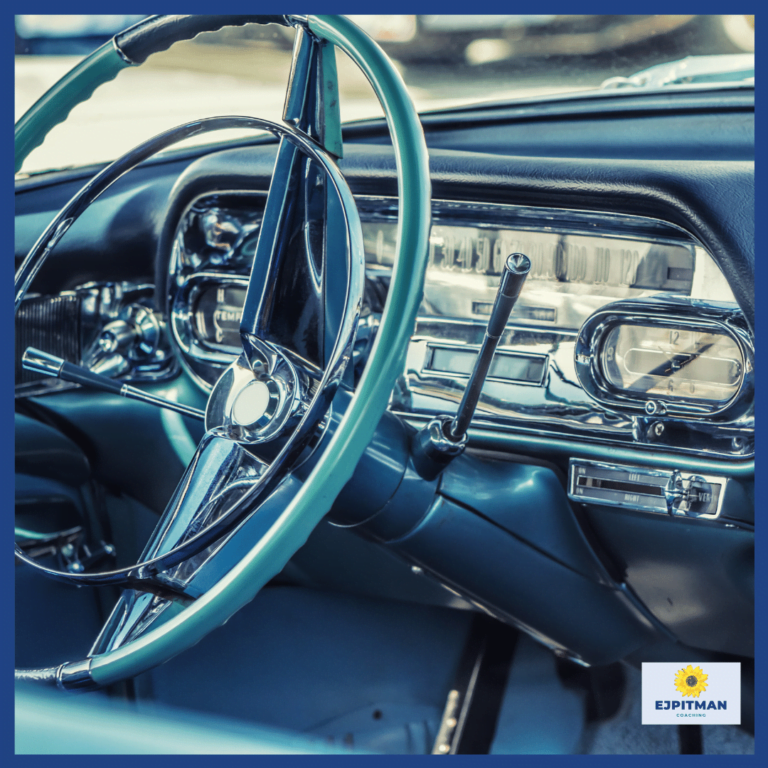 old car steering wheel and dashboard with a blue green hue