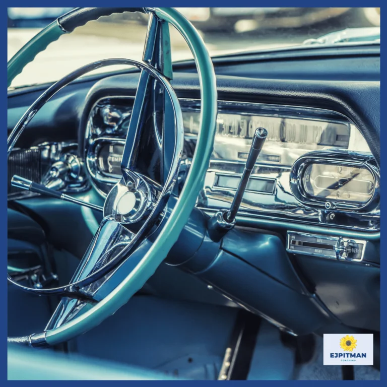 old car steering wheel and dashboard with a blue green hue