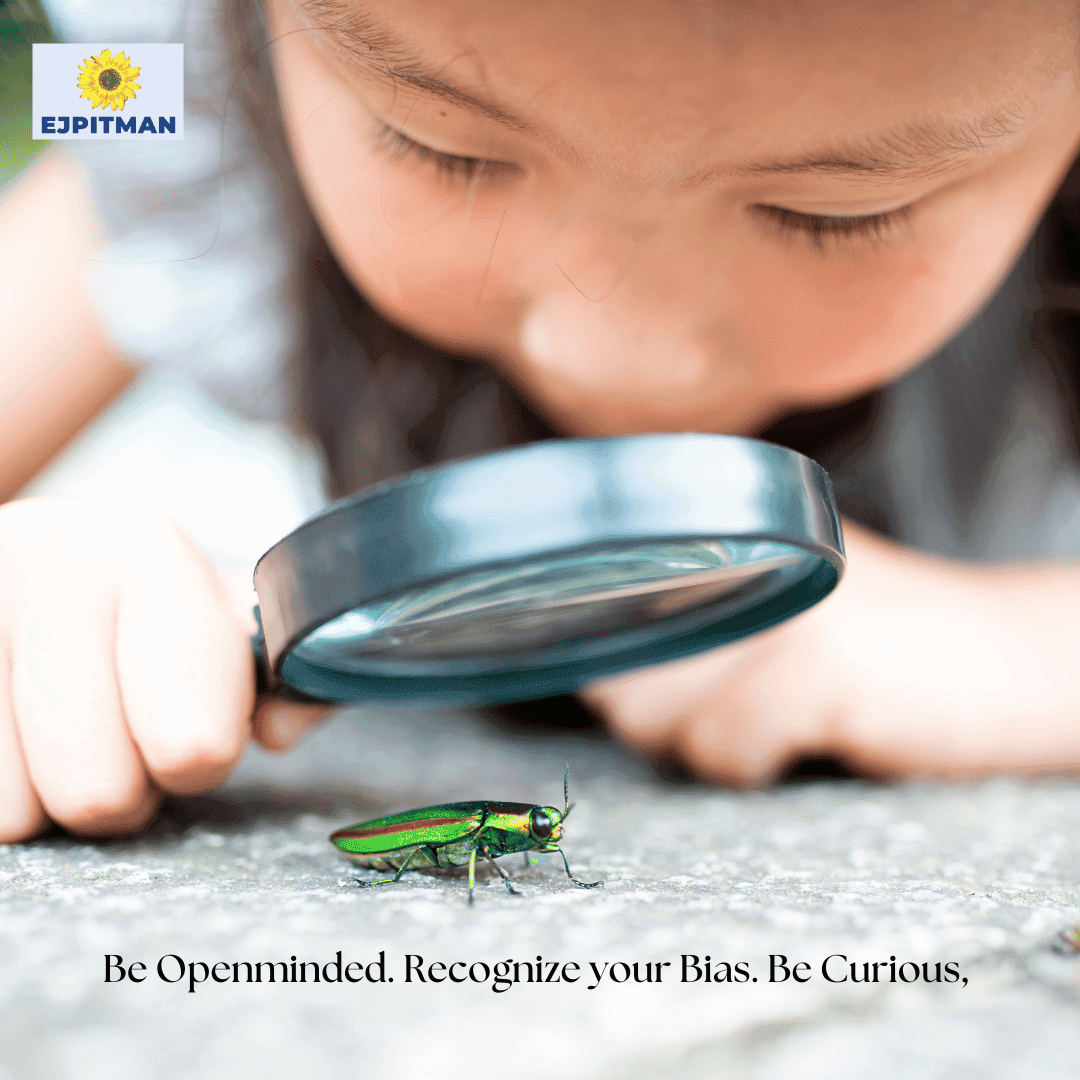 young child looking through microscope at beatle with text 'be openminded. recognize your Bias. Be Curious' and brand logo ejpitman